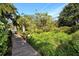 Wooden boardwalk winds through a tranquil nature preserve at 1709 Pelican Cove Rd # Gl445, Sarasota, FL 34231