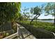 Wooden boardwalk path through lush vegetation at 1709 Pelican Cove Rd # Gl445, Sarasota, FL 34231