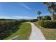 Peaceful walkway meanders through a beautifully landscaped area at 1709 Pelican Cove Rd # Gl445, Sarasota, FL 34231