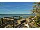 Scenic waterfront deck with benches offering tranquil views at 1709 Pelican Cove Rd # Gl445, Sarasota, FL 34231