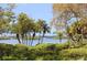 Beautiful waterfront view with lush tropical foliage at 1709 Pelican Cove Rd # Gl445, Sarasota, FL 34231