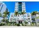Luxury highrise building with palm trees and waterfront views at 258 Golden Gate Pt # 801, Sarasota, FL 34236