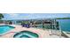 Resort-style pool and spa with waterfront views at 258 Golden Gate Pt # 801, Sarasota, FL 34236