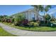 Well-maintained home with lush landscaping and a paved walkway at 5433 Hope Sound Cir, Sarasota, FL 34238