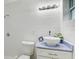 Clean bathroom with a white vessel sink and tiled walls at 730 40Th St, Sarasota, FL 34234