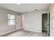 Light and airy bedroom with window, closet, and wood-look floors at 730 40Th St, Sarasota, FL 34234