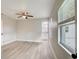Spacious bedroom with ceiling fan and view of backyard at 730 40Th St, Sarasota, FL 34234