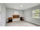 Light grey bedroom with wood-look floors and window at 730 40Th St, Sarasota, FL 34234