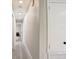 Long hallway with light walls and wood-look flooring at 730 40Th St, Sarasota, FL 34234