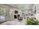 Open living space with gray couch and dining table, featuring modern decor at 730 40Th St, Sarasota, FL 34234