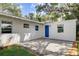 Cozy patio area with brick pavers and blue door at 730 40Th St, Sarasota, FL 34234