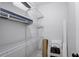 White wire shelving unit in a spacious storage room at 730 40Th St, Sarasota, FL 34234