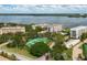 Aerial view of community with tennis courts and waterfront at 8701 Midnight Pass Rd # 106A, Sarasota, FL 34242