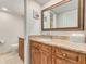 Elegant bathroom with granite countertops and updated cabinetry at 8701 Midnight Pass Rd # 106A, Sarasota, FL 34242