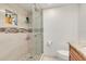 Clean bathroom with a walk-in shower and tile flooring at 8701 Midnight Pass Rd # 106A, Sarasota, FL 34242