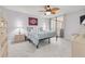 Bright bedroom with a king-size bed and access to a balcony at 8701 Midnight Pass Rd # 106A, Sarasota, FL 34242