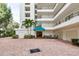 Condo building exterior with parking and entrance at 8701 Midnight Pass Rd # 106A, Sarasota, FL 34242