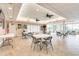 Spacious community room with tables, chairs, and a view at 8701 Midnight Pass Rd # 106A, Sarasota, FL 34242
