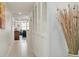 Bright hallway with white walls and tile floors at 8701 Midnight Pass Rd # 106A, Sarasota, FL 34242