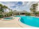 Community pool with spa and ample seating for relaxation at 8701 Midnight Pass Rd # 106A, Sarasota, FL 34242