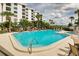 Inviting kidney-shaped pool with spa and comfortable seating at 8701 Midnight Pass Rd # 106A, Sarasota, FL 34242