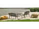 Relaxing waterfront seating area with benches and table at 8701 Midnight Pass Rd # 106A, Sarasota, FL 34242