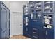 Custom navy blue built-in cabinets offer ample storage and add elegance at 12147 Maple Ridge Dr, Parrish, FL 34219