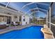 Beautiful screened-in pool area with outdoor seating and access to the home's interior, perfect for entertaining at 12147 Maple Ridge Dr, Parrish, FL 34219