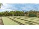 Well-maintained shuffleboard courts with benches at 1302 58Th W St, Bradenton, FL 34209