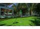 Putting green and pool with lounge chairs in the backyard at 212 Spring Ave, Anna Maria, FL 34216