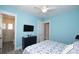 Bright bedroom with a queen bed and en-suite bathroom at 212 Spring Ave, Anna Maria, FL 34216