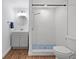Updated bathroom, features a walk-in shower, gray vanity, and modern fixtures at 3919 116Th Street W Ct, Bradenton, FL 34210