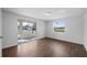 Bright bedroom with sliding door to patio and wood-look floors at 3919 116Th Street W Ct, Bradenton, FL 34210
