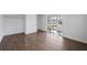 Spacious bedroom with hardwood floors and sliding glass door to patio at 3919 116Th Street W Ct, Bradenton, FL 34210