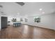 Open concept kitchen with island, stainless steel appliances, and hardwood floors at 3919 116Th Street W Ct, Bradenton, FL 34210