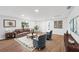 Bright living room features hardwood floors, comfy seating, and tasteful decor at 3919 116Th Street W Ct, Bradenton, FL 34210
