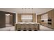 Modern kitchen with island and stainless steel appliances at 555 Quay Cmn # 1603, Sarasota, FL 34236