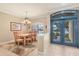 Formal dining room with chandelier and hardwood floors at 7115 Treymore Ct, Sarasota, FL 34243