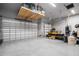 Spacious two-car garage with overhead storage and epoxy floor at 8 Idle Ct, Placida, FL 33946