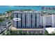 Aerial view of a modern condo building with water access and city views at 101 S Gulfstream Ave # 11E, Sarasota, FL 34236