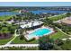 Community pool with surrounding green space at 1010 Tidewater Shores Loop # 103, Bradenton, FL 34208