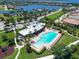 Resort-style community pool, clubhouse, and tennis courts at 1010 Tidewater Shores Loop # 103, Bradenton, FL 34208