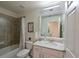 Clean bathroom with a walk-in shower and modern vanity at 1010 Tidewater Shores Loop # 103, Bradenton, FL 34208