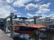 Orange and black boat on lift at dock at 1010 Tidewater Shores Loop # 103, Bradenton, FL 34208