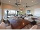 Community room with tables, chairs, and a view of the marina at 1010 Tidewater Shores Loop # 103, Bradenton, FL 34208