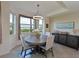 Bright dining area with table and chairs, offering water views at 1010 Tidewater Shores Loop # 103, Bradenton, FL 34208