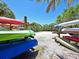 Kayaks neatly stored on racks near the water at 1010 Tidewater Shores Loop # 103, Bradenton, FL 34208