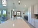 Elegant kitchen with a large island and white quartz countertops at 1010 Tidewater Shores Loop # 103, Bradenton, FL 34208