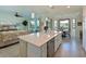 Open concept kitchen with island, stainless steel appliances, and breakfast nook at 1010 Tidewater Shores Loop # 103, Bradenton, FL 34208