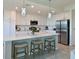 Bright kitchen with center island, stainless steel appliances, and white cabinetry at 1010 Tidewater Shores Loop # 103, Bradenton, FL 34208
